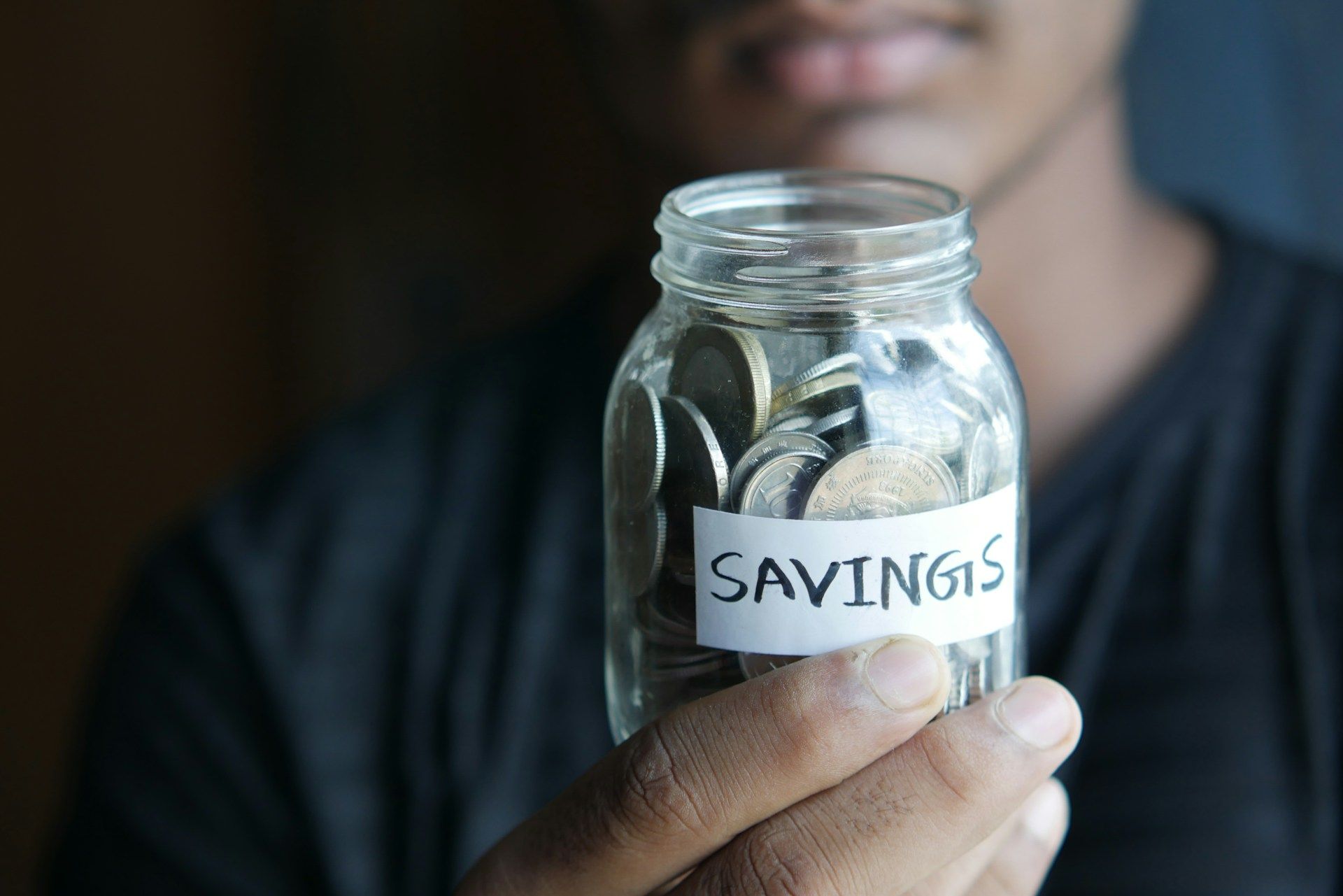 Money spread out on a table representing savings rate impact on retirement