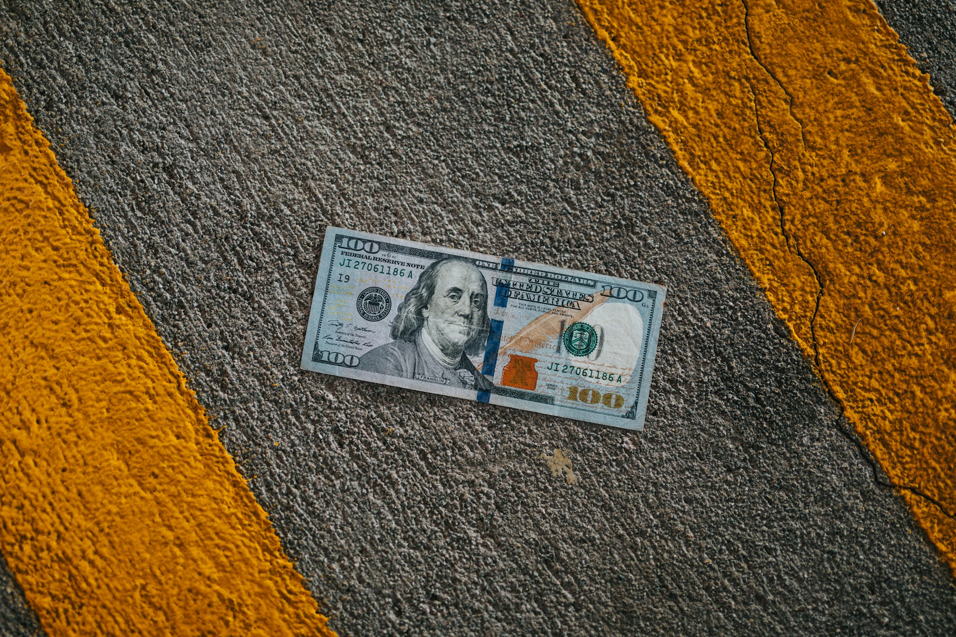 Money on the road representing the financial impact of relocating from California to Texas