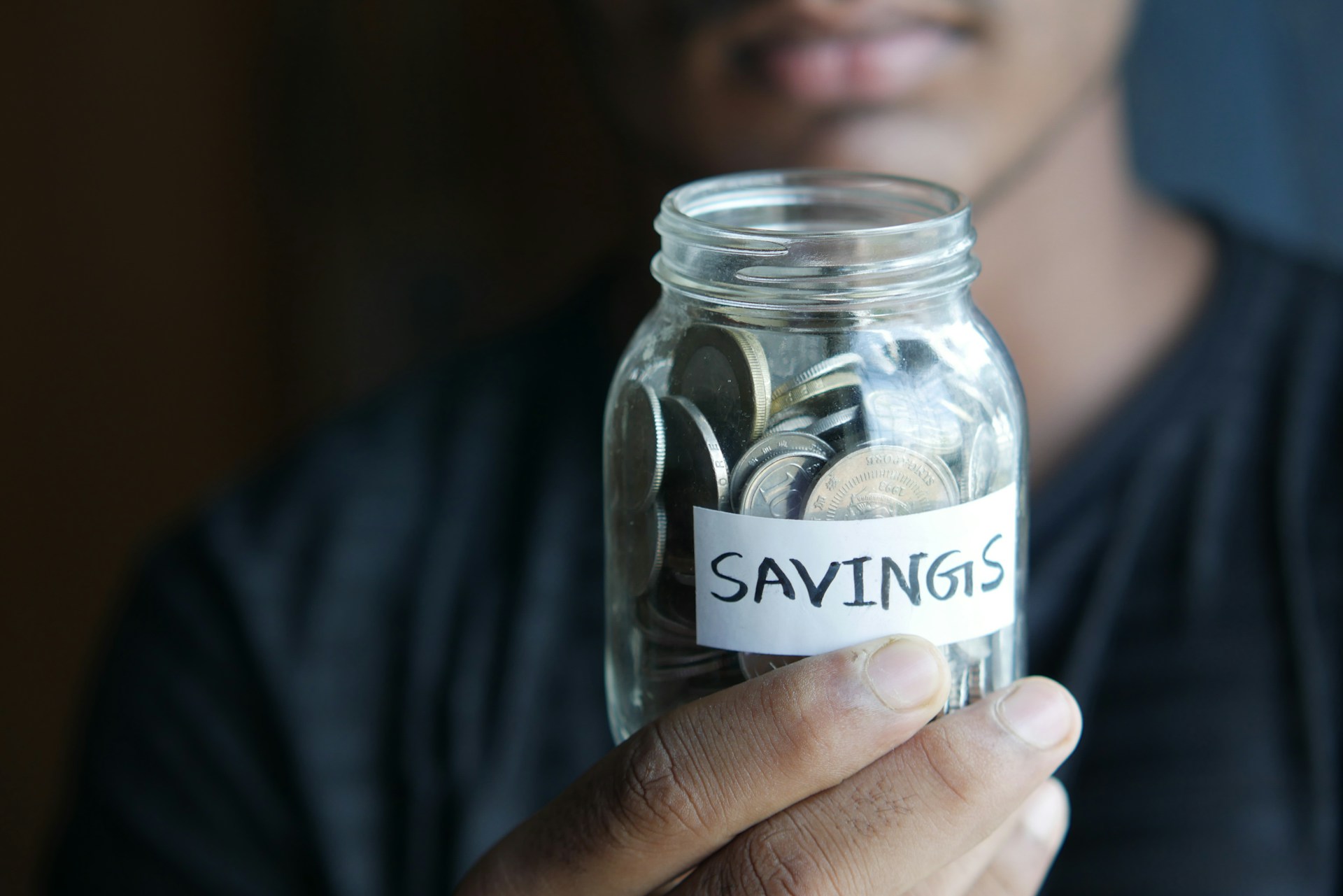 Money spread out on a table representing savings rate impact on retirement